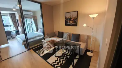 Modern studio apartment with cozy living area and stylish bedroom