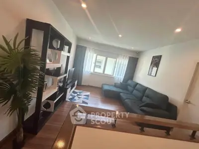 Spacious living room with modern decor and large sectional sofa