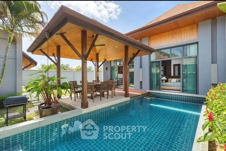 Luxurious villa with private pool and outdoor dining area, perfect for tropical living.