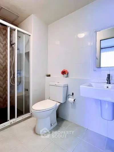 Modern bathroom with sleek shower and elegant fixtures