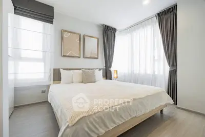 Elegant bedroom with large windows and modern decor