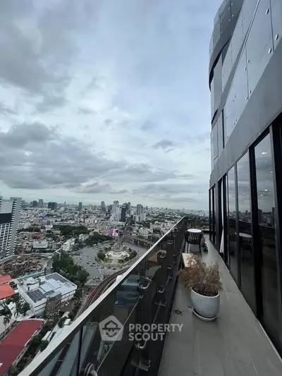 Stunning high-rise balcony with panoramic city views, perfect for urban living enthusiasts.