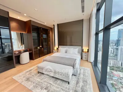 Luxurious high-rise bedroom with stunning city view and modern decor