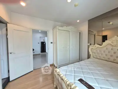 Luxurious bedroom with elegant furniture and mirrored wall in modern apartment