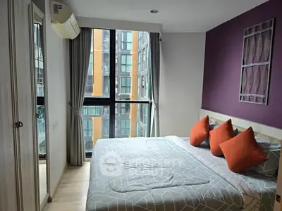 Modern bedroom with large windows and stylish decor in urban apartment