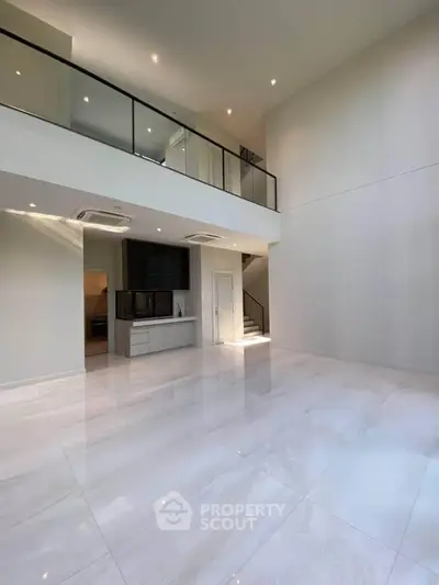 Spacious modern living room with high ceilings and sleek design