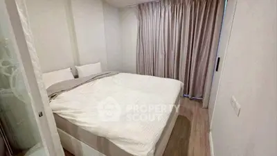Cozy bedroom with large bed and soft lighting, perfect for relaxation.