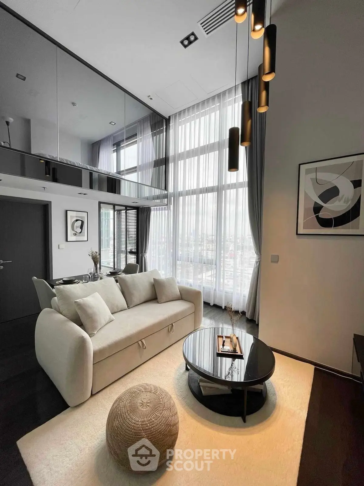 Luxurious modern living room with high ceilings and elegant decor