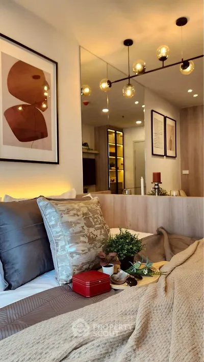 Modern bedroom with stylish decor and warm lighting, featuring a cozy bed and elegant wall art.