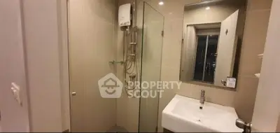 Modern bathroom with glass shower and sleek sink design