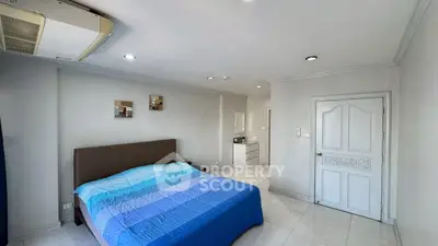 Spacious bedroom with modern decor and air conditioning