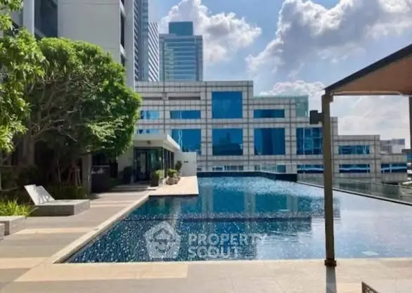 Luxurious high-rise building with stunning rooftop pool and city views