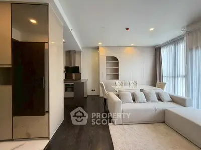 Modern living room with sleek design and open kitchen layout