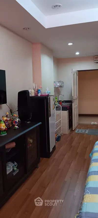 Cozy bedroom with wooden flooring and modern decor