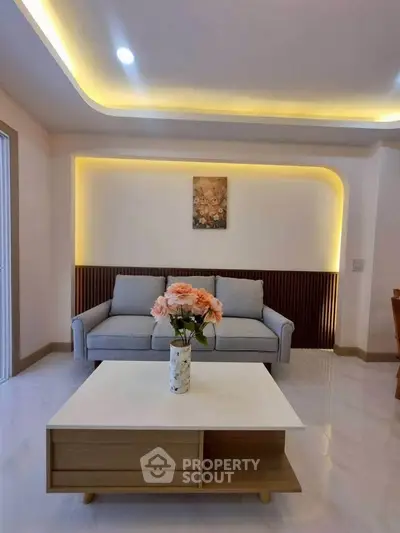 Modern living room with stylish sofa and elegant lighting