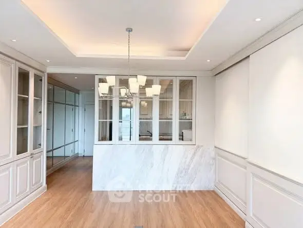 Elegant modern interior with wooden flooring and stylish lighting