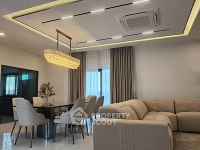 Luxurious modern living room with elegant dining area and plush seating