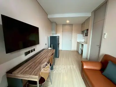 Modern living room with sleek furniture and open kitchen layout