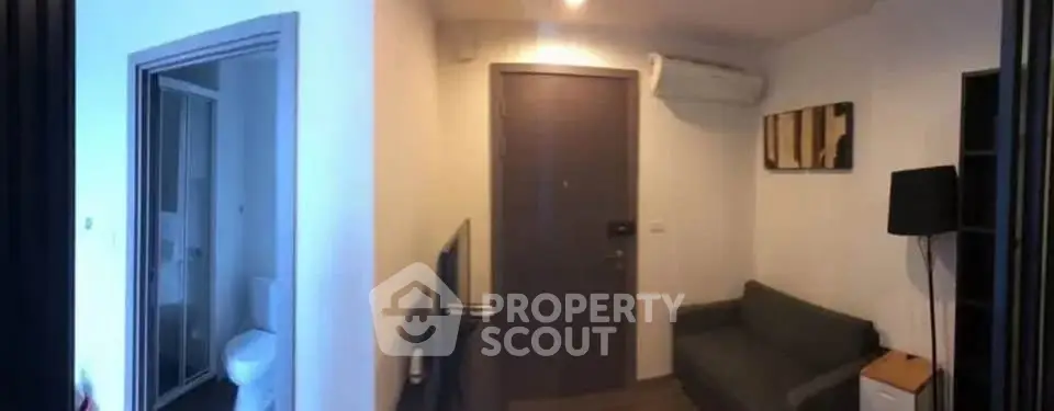 Cozy apartment entrance with modern decor and compact living space.