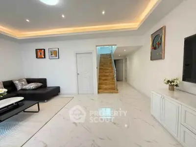 Spacious modern living room with elegant decor and marble flooring
