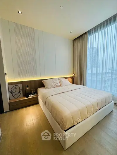 Luxurious modern bedroom with floor-to-ceiling windows and elegant decor.