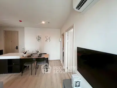 Modern living room with dining area and air conditioning in stylish apartment