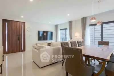 Spacious modern living room with elegant dining area and natural light