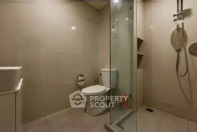 Modern bathroom with glass shower and sleek fixtures