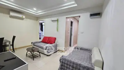 Modern living room with cozy seating and stylish decor