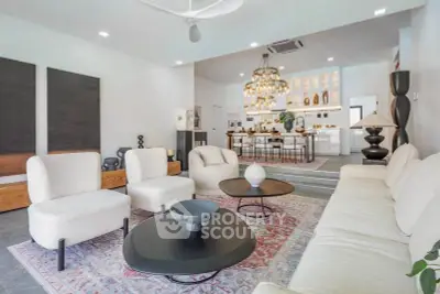Spacious modern living room with elegant decor and open kitchen layout, perfect for entertaining.