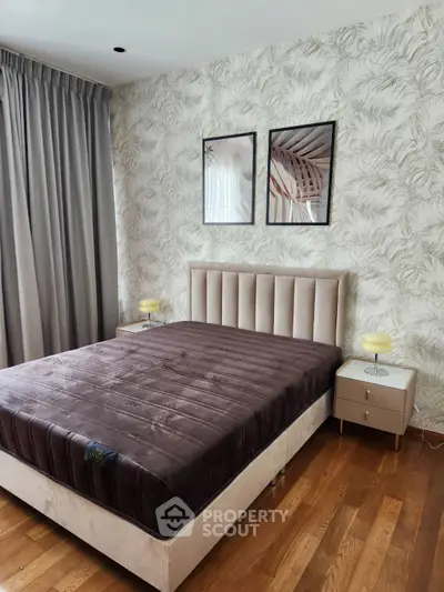 Elegant bedroom with stylish decor and cozy ambiance, featuring a plush bed and modern furnishings.