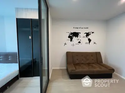 Modern apartment interior with world map wall art and cozy brown sofa