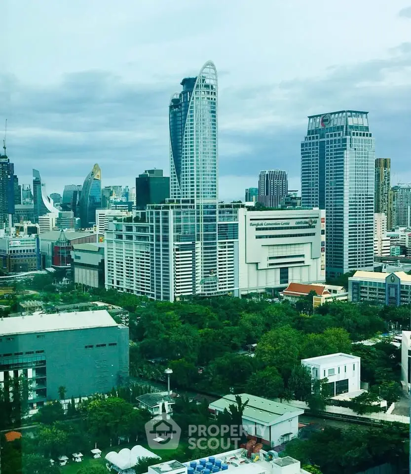 Stunning cityscape view showcasing modern skyscrapers and lush greenery in a vibrant urban setting.