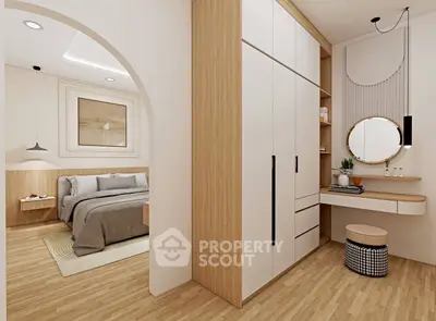 Modern bedroom with stylish wooden flooring and built-in wardrobe