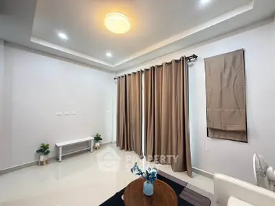 Spacious modern living room with elegant curtains and stylish lighting