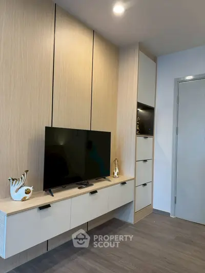 Modern living room with sleek TV unit and elegant decor