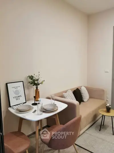 Cozy small living room with modern decor and dining area