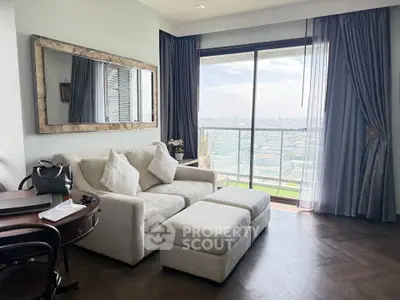 Spacious living room with elegant decor and stunning city view from large window.