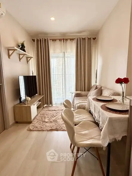 Cozy living room with modern decor and natural light, featuring a plush rug and elegant dining setup.
