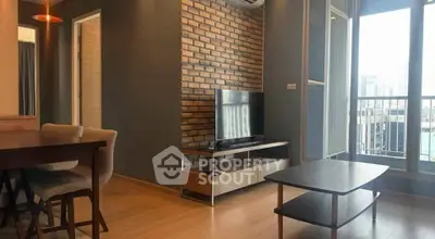 Modern living room with brick accent wall and large windows