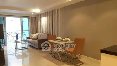 Modern living room with elegant dining area and balcony view