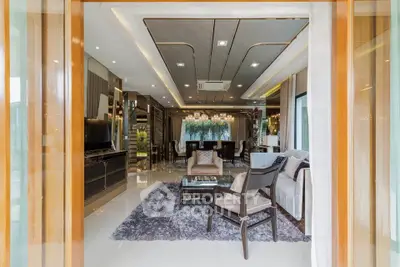 Luxurious open-plan living room with elegant decor and modern furnishings, perfect for entertaining.