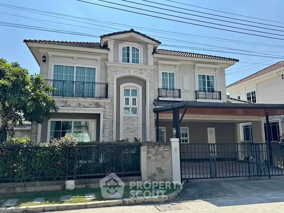 Elegant two-story house with modern facade and spacious driveway in suburban neighborhood.