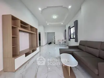 Spacious modern living room with elegant furniture and marble flooring