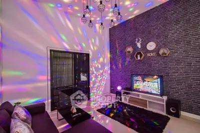 Modern living room with vibrant lighting and stylish decor