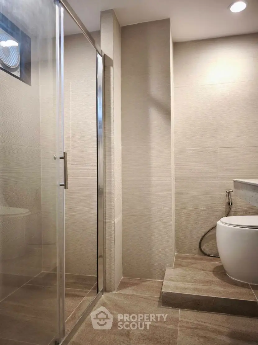 Modern bathroom with sleek shower and contemporary fixtures
