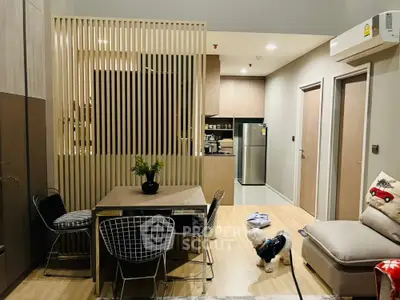 Modern open-plan living room with stylish dining area and kitchen