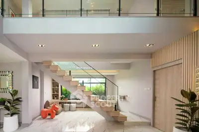 Modern living room with stylish staircase and open layout, featuring elegant decor and natural light.