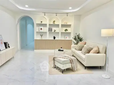 Elegant living room with modern decor and cozy seating area