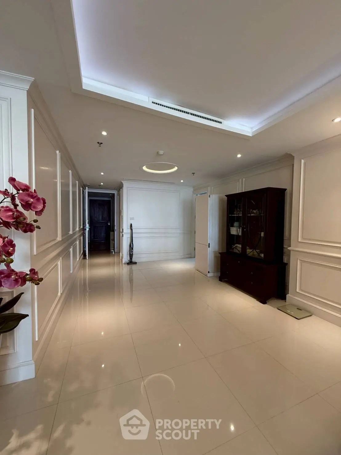 Elegant hallway with modern lighting and sleek tile flooring